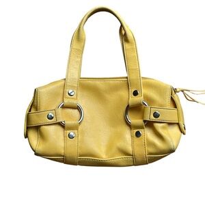 Small mustard yellow handbag with silver tone hardware, vegan leather